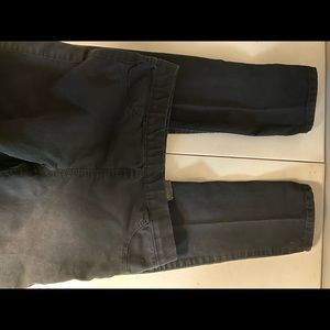 Black “skinny jeans”